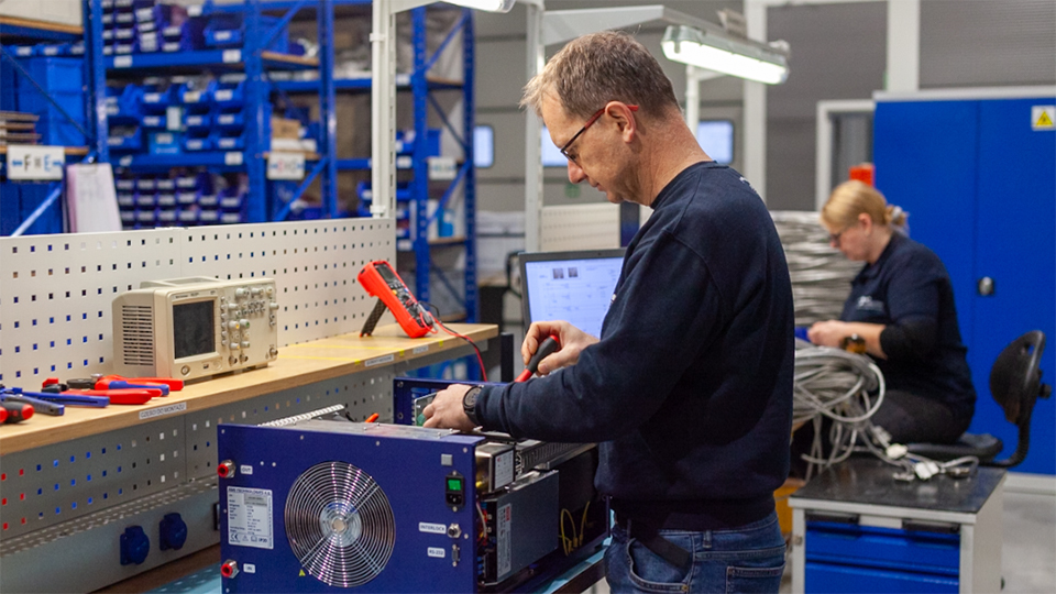 An AMS employee assembling a recirculating chiller