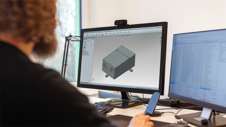 Picture of an AMS employee doing CAD engineering Picture of an AMS employee doing CAD engineering